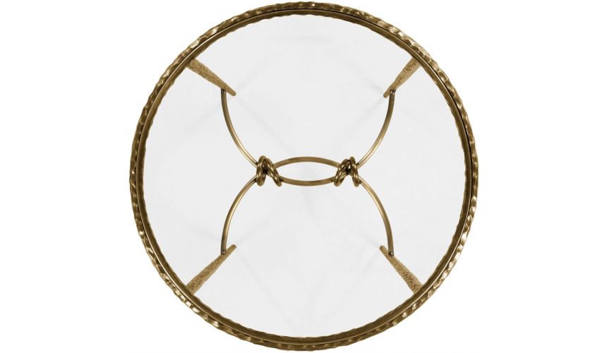 Patinated finish hammered brass circular side table.