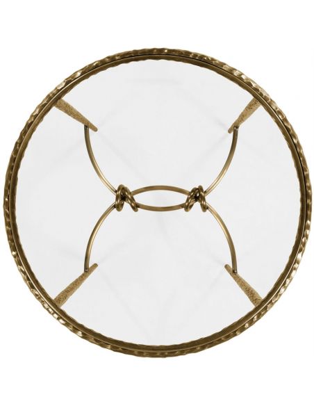 Patinated finish hammered brass circular side table.