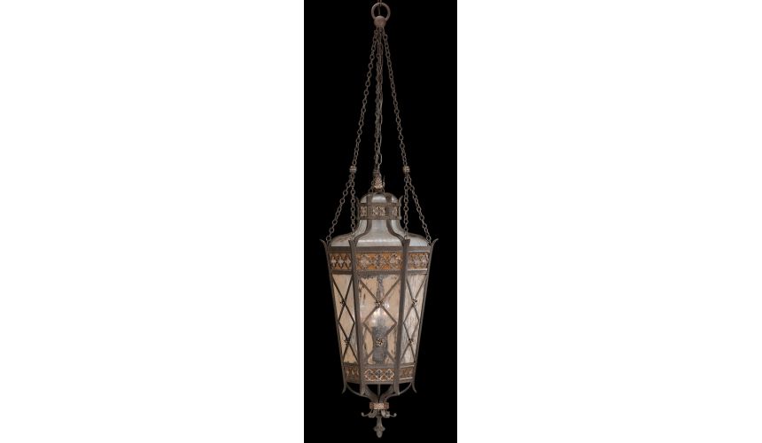 Lighting Medium lantern of solid brass featuring a variegated rich umber patina