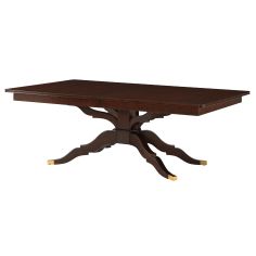 an attention-grabbing dining table with unique carved legs and brass accents 2