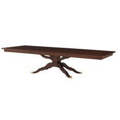 an attention-grabbing dining table with unique carved legs and brass accents