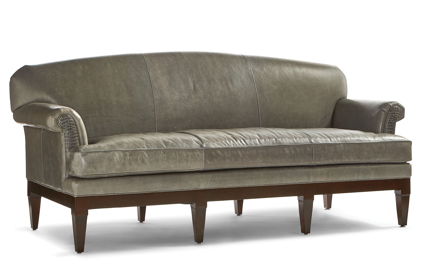 Julia Sofa is a highly sophisticated piece of furniture with cushioned seating and subtle color tones