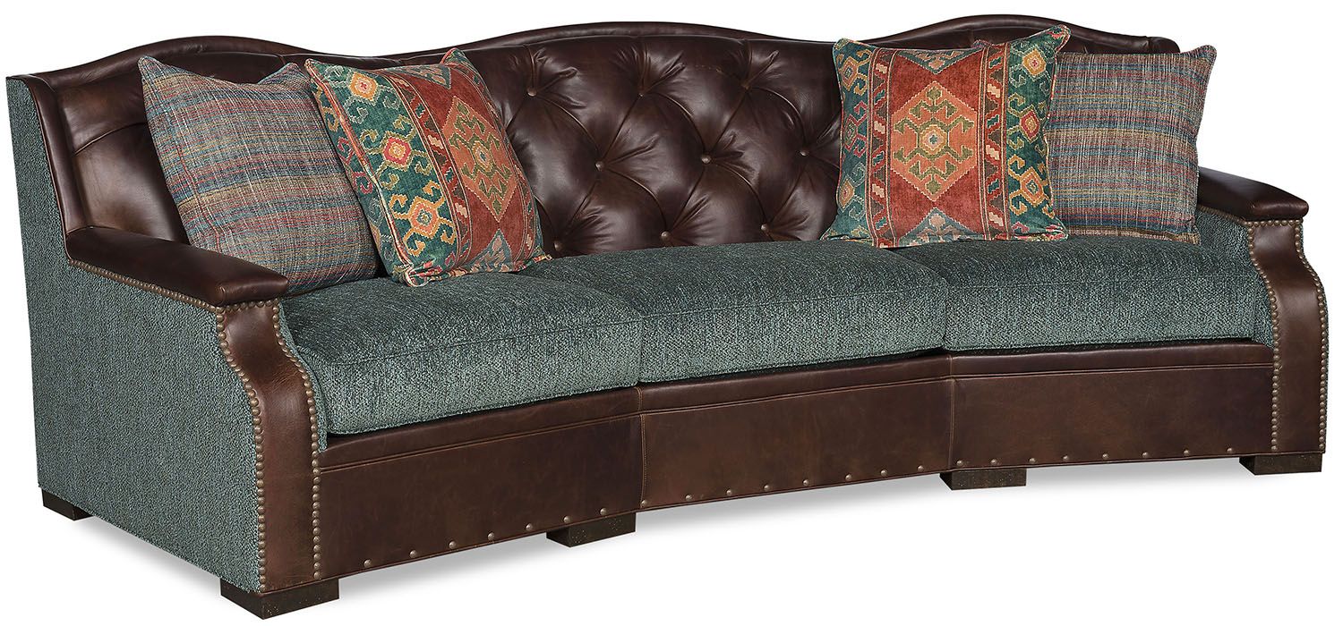 gorgeous sofa is made of fine leather and features an elegant tufting