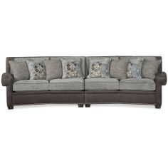 The intricately curved sofa is embellished with buttoned details and perfectly merges aesthetic charm with soft seating.