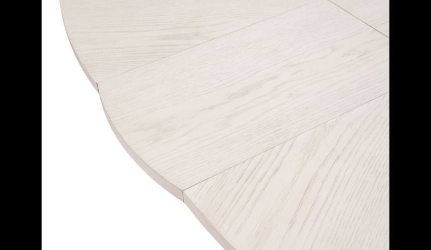 Large round table with self storing leaves