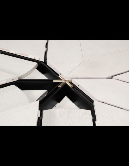 The Giselle Jupe Table is extendable and features a traditional touch with curves and facets on its base.