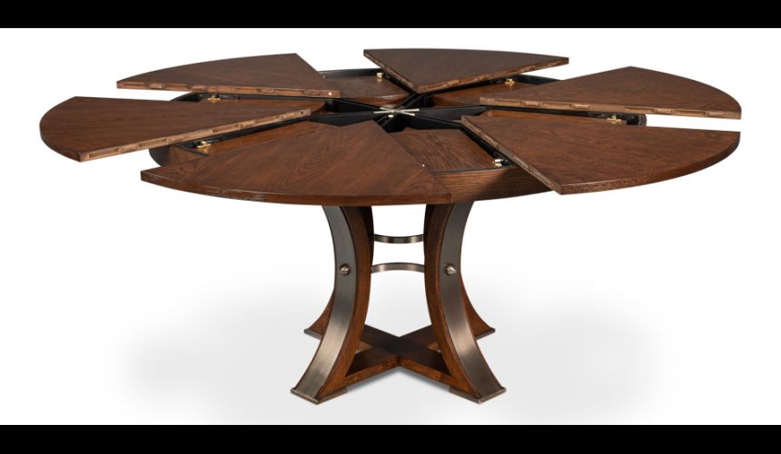 70-inch round table with self-storing leaves. Palladio finished on oak wood