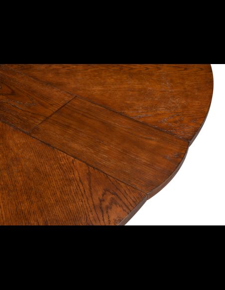 70-inch round table with self-storing leaves. Palladio finish on oak wood