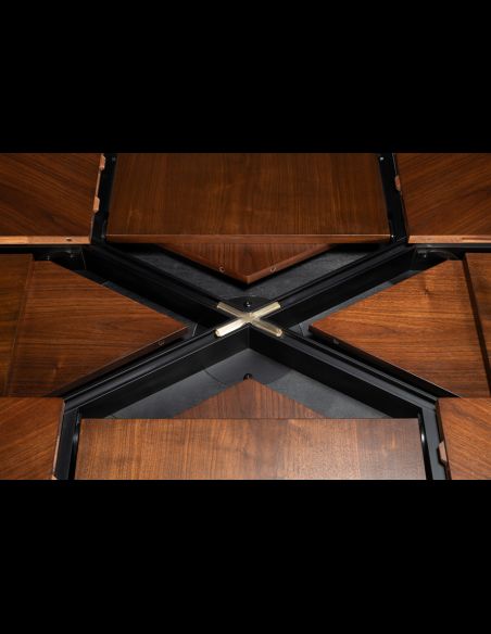 Rectangular expandable Jupe table with self-storing leaves.