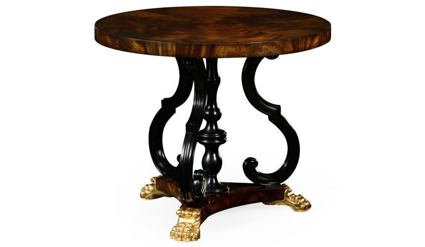 Foyer and Center Tables Mahogany centre table with gilt lions paw feet.