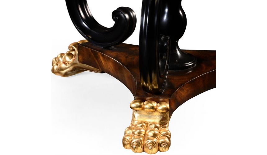 Foyer and Center Tables Mahogany centre table with gilt lions paw feet.