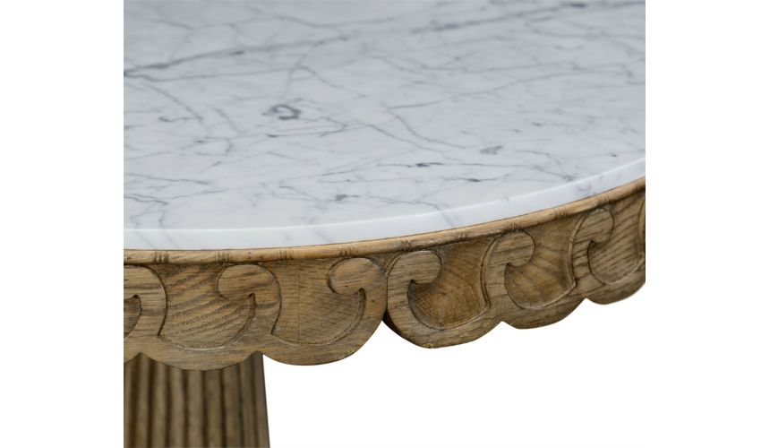 Foyer and Center Tables Carved oak table with marble top.