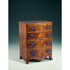 Chest of Drawers A Regency walnut & mahogany bowfront chest of drawers