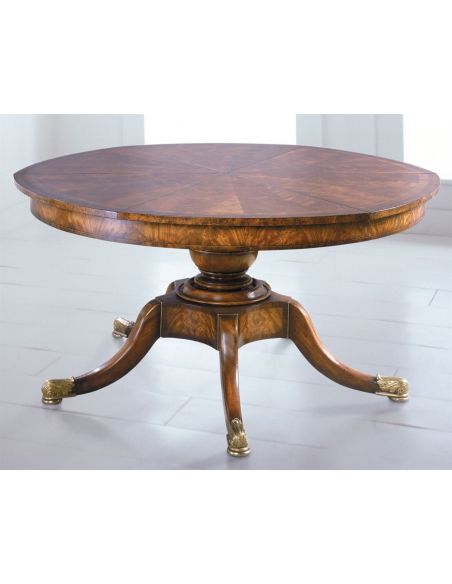 Circular extending formal mahogany dining table.