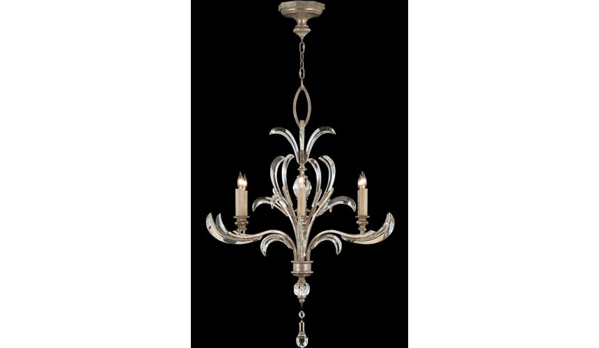 Lighting Chandelier in a warm muted silver leaf finish featuring beveled crystal accents
