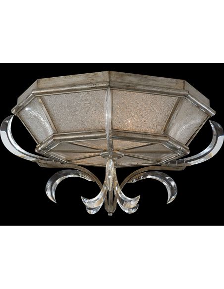 Flush mount in warm muted silver leaf finish. Features beveled crystal accents