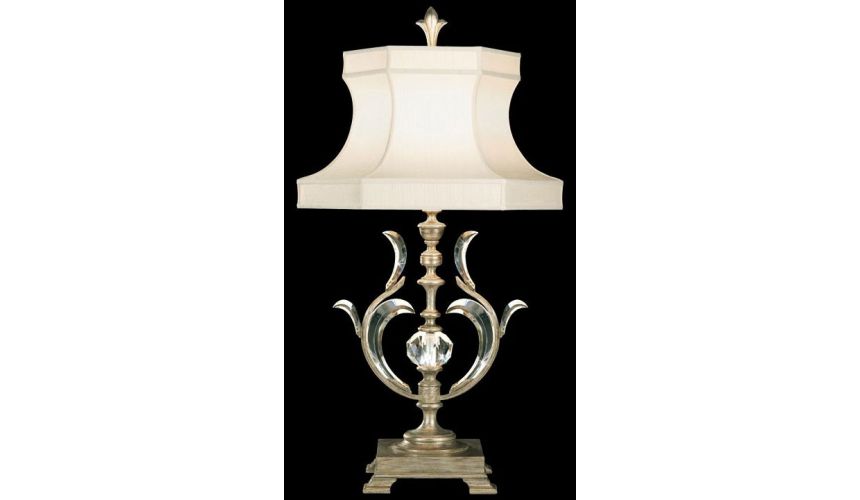 Lighting Table lamp in warm muted silver leaf finish. Features laminated silk shantung shade