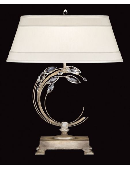 Right-side facing table lamp in antiqued warm silver leaf