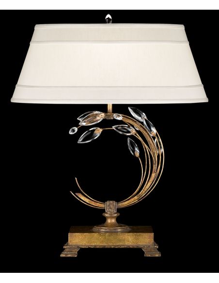 Left-side facing table lamp in gold leaf with stylized faceted crystal leaves