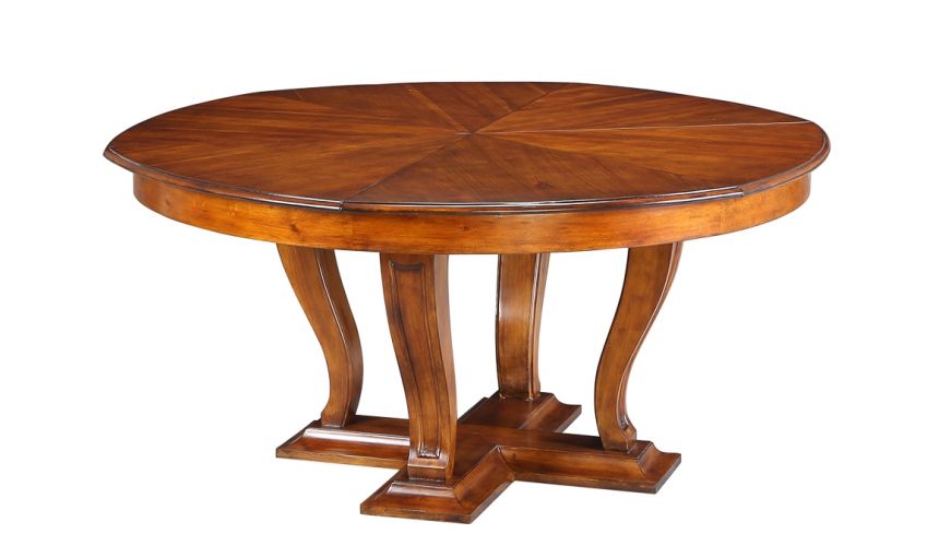 Dining Tables Transitional style round table with self storing leaves.