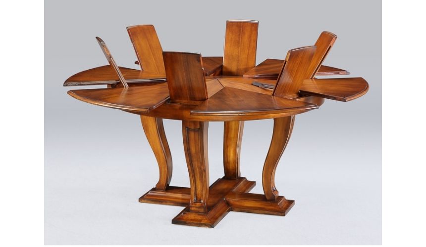 Dining Tables Transitional style round table with self storing leaves.