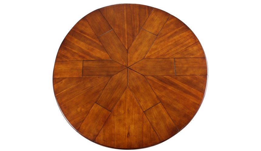 Dining Tables Transitional style round table with self storing leaves.