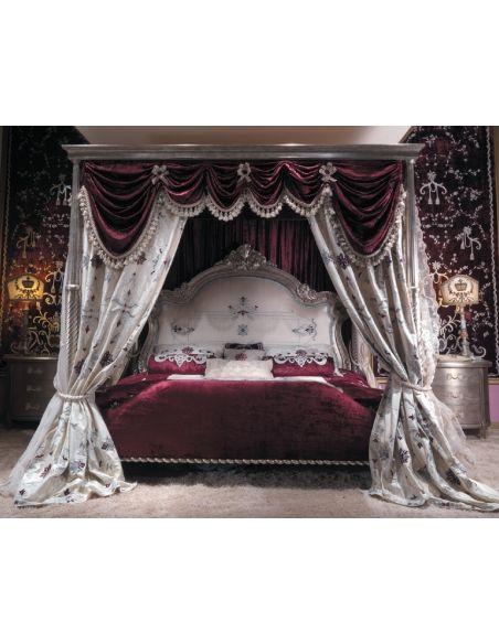 Master bed with canopy and embroidered headboard. Scarlet red