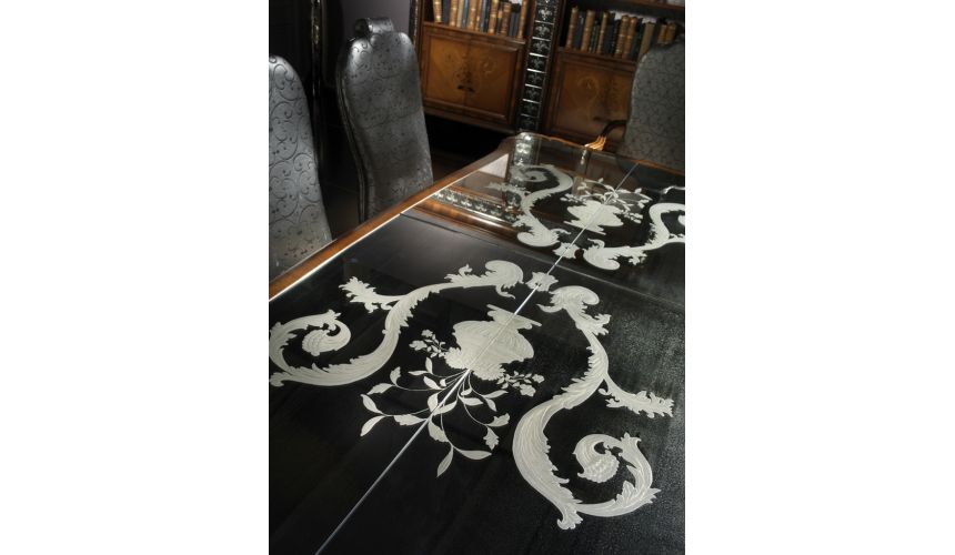 Dining Tables Fine carvings and a etched glass top highlight this dining set.